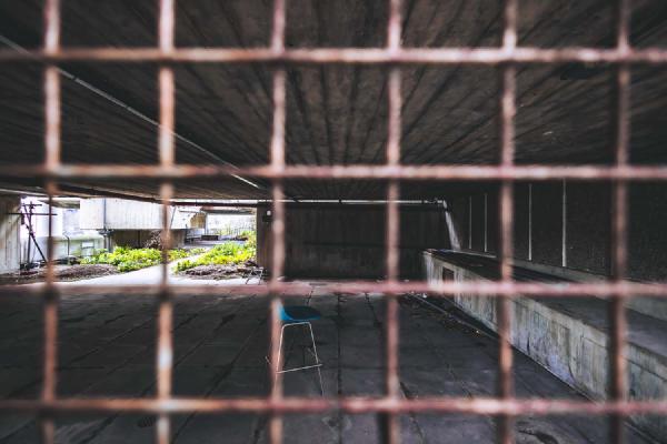 The barstool, the greenery and the sunlight in the distance. A sense of pervasive loneliness